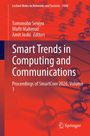 "Smart Trends in Computing and Communications" auf orangefarbenem Hintergrund mit Molekülstruktur. Springer-Logo unten.