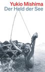 Text: "Yukio Mishima Der Held der See". Junge im Wasser freut sich mit gefangenem Fisch.