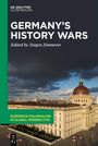„Germany's History Wars“, herausgegeben von Jürgen Zimmerer. Ein Foto zeigt ein historisches Gebäude unter dunklem Himmel.