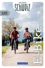 "Erlebnis Schweiz. Mit GPX-Dateien. E-Bike Rundtouren." Zwei Personen fahren auf einem Weg in einer ländlichen Umgebung.