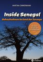"Inside Senegal: Nahaufnahmen im Land der Teranga." Silhouette eines Baobab-Baums vor blauem Himmel.