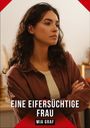 „EINE EIFERSÜCHTIGE FRAU“, „MIA GRAF“. Frau mit braunem Haar, verschränkten Armen, ernstem Blick.