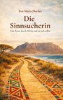 "Eva-Maria Flucher: Die Sinnsucherin. Eine Reise durch Afrika und zu sich selbst." zeigt einen farbenfrohen Weg vor einem Berg.