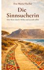 "Die Sinnsucherin" von Eva-Maria Flucher. Afrikanische Landschaft mit buntem Pfad am Meer, Berge im Hintergrund.