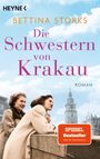 Text: "Bettina Storks, Die Schwestern von Krakau, Roman, SPIEGEL Bestseller". Zwei Frauen in Mänteln vor historischem Gebäude.