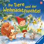 "Die Tiere und der Weihnachtswichtel" steht in gelber Schrift auf blauem Hintergrund. Ein Wichtel spielt mit Tieren.