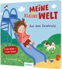 "MEINE KLEINE WELT: Auf dem Spielplatz, Erste Bilder – erste Sätze." Kind rutscht Rutsche, Hund spielt im Gras, Vogel oben.
