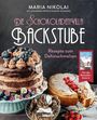 "Die Schokoladenvilla Backstube, Rezepte zum Dahinschmelzen." Kuchen mit Blaubeeren und Keksen.