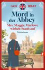Titel: "Mord in der Abbey". Untertitel: "Mrs. Maggie Marlowe wirbelt Staub auf". Frau im Trenchcoat schaut auf alte Abtei.