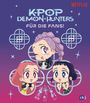 „K-Pop Demon Hunters: Für die Fans!“ in glänzender Schrift, drei fröhliche Anime-Charaktere mit bunten Haaren, lila Hintergrund.
