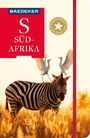 "BAEDEKER S SÜD-AFRIKA". Ein Zebra in einer goldenen Savannenlandschaft, zwei weiße Vögel landen auf seinem Rücken.