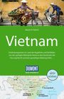 „Vietnam“ von Martin H. Petrich, Entdeckungsreisen im Land der Kegelhüte. Dumont Reise-Handbuch. Oben: Frau mit Fahrrad voller Früchte.