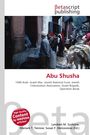 "Abu Shusha" steht in Rot. Menschen in einer engen Straße, ein Esel mit Last im Vordergrund, orientalisches Ambiente.