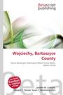 Text: Wojciechy, Bartoszyce County. Bunte, geschwungene Linien in Grün und Beige. Oben Logo „betascript publishing“.