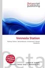 "Vennesla Station" und Verleger "Betascript Publishing" oben. Abstrakte blaue Wellen darunter.