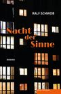 „Nacht der Sinne“ in Orange, Ralf Schwob, Roman, beleuchtete Fenster eines Wohnhauses in der Nacht.