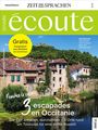 écoute, gratis Französisch zum Wandern, 3 escapades en Occitanie. Alte Gebäude am Fluss, bewaldete Hügel im Hintergrund.