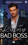 Text: "HAILEY J. ROMANCE", "Kiss my BAD BOSS". Ein Mann im Anzug vor einer nächtlichen Skyline.