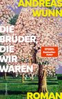„ANDREAS WUNN, DIE BRÜDER DIE WIR WAREN, ROMAN, SPIEGEL Bestseller-Autor“. Malerei von blühenden Bäumen auf grünem Rasen.
