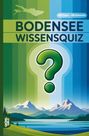 Text: "BODENSEE WISSENSQUIZ", "100 Fragen - 400 Antworten". Illustration von Bergen, See und Fragezeichen.
