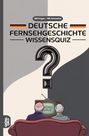 100 Fragen - 400 Antworten. Deutsche Fernsehgeschichte Wissensquiz. Älteres Paar vor einem Fernseher mit GRÜBEL GOLD.