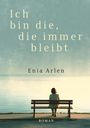 „Ich bin die, die immer bleibt“, Enia Arlen, Roman. Eine Person sitzt auf einer Bank vor einem ruhigen See.