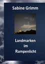 Sabine Grimm, Landmarken im Rampenlicht. Ein nächtliches Foto mit beleuchtetem Gebäude und dunklem Himmel.