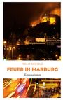 Text: "Felix Scholz, Feuer in Marburg, Kriminalroman." Nachtaufnahme einer beleuchteten Burg und verschwommene Straßenlichter.
