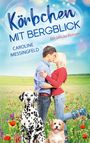 Text: "Körbchen mit Bergblick", "Caroline Messingfeld", "Ein Glücks-Roman". Ein Paar küsst sich auf einer Blumenwiese, zwei Hunde.