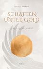 „SCHATTEN UNTER GOLD“, „VERBORGENE MACHT“, „ROMAN“. Ein goldener Kreis mit Flügeln im Hintergrund auf hellem Grund.