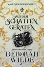 Texts: "Magie nach der Lebensmitte," "Aus dem Schatten geraten," "Humorvolle Urban Fantasy," "Deborah Wilde."  
Visual: Elegante Goldverzierungen, eine funkelnde schwarze Tasche.