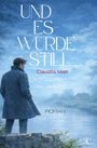 „UND ES WURDE STILL“, Claudia Iwer, ROMAN; ein Mann im Mantel blickt auf ein Haus am See in einer ruhigen Landschaft.