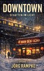 "DOWNTOWN", "SCHATTEN IM LICHT", "WAN QEN 43RD", "EPISODE 1", "JÖRG RAMPKE". Eine verschneite Stadt mit Zug und laden.