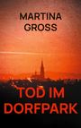 Text: "MARTINA GROSS", "TOD IM DORFPARK". Silhouette einer Stadt mit Kirchturm im roten Himmel.