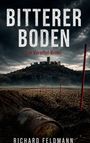 BITTERER BODEN: Ein Voreifel-Krimi. Der Himmel ist düster über einer Burg auf einem Hügel, im Vordergrund ein rostiges Fass.