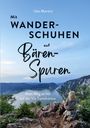 „Mit Wanderschuhen auf Bärenspuren – Mein Weg zu mir auf der Via Transilvanica“ von Ute Martini. Frau blickt auf Fluss in Berglandschaft.