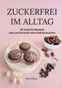 ZUCKERFREI IM ALLTAG. 82 Rezepte ohne Industriezucker. Drei Schokomuffins, Datteln und Schokostücke auf rosa Stoff.