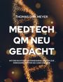 Text: "Thomas Dirk Meyer, Medtech QM neu gedacht, mit der richtigen Unternehmens-QM-DNA zur Wirksamkeit unter ISO 13485 und MDR." 
Hintergrund: Goldene DNA-Helix.