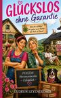 Der Text lautet "GLÜCKSLOS ohne Garantie". Zwei Frauen stehen vor einer Pension mit Blumen, Koffer und einem Hund.