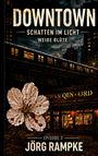 "DOWNTOWN: SCHATTEN IM LICHT, WEIßE BLÜTE, EPISODE 3, JÖRG RAMPKE." Stadt bei Nacht, Bahn, Blüte und Laternen.