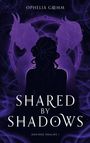 "Ophelia Grimm. Shared by Shadows. Desired Realms I." Silhouetten zweier gehörnter Figuren hinter einer Frau, violette Töne.
