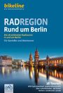 "RADREGION Rund um Berlin. 28 Radtouren. Illustration: Oberbaumbrücke, Stadtbild mit Wasser, modernes Gebäude links."