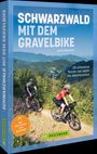 „Schwarzwald mit dem Gravelbike“ von Jakob Niemeyer. Zwei Radfahrer auf einem Waldweg mit Blick auf bewaldete Hügel.