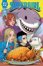 Text: "ALL IN 3 SUPERGIRL". Illustration eines Hais und vier Personen um einen Braten; ein Hund mit Umhang und eine Katze.
