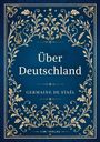 "Über Deutschland" von Germaine de Staël, LIWI Verlag. Verziert mit goldenen floralen Mustern auf blauem Hintergrund.