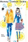 „Honey Lemon Soda“, Band 9. Illustration: Ein blondhaariger Junge hält die Hand eines schwarzhaarigen Mädchens.