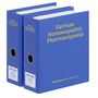 Zwei blaue Ordner, ein großer mit „German Homoeopathic Pharmacopoeia“ und ein kleinerer mit „GHP 2025 Volume 2“.