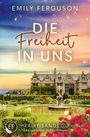 Text: "Emily Ferguson. Die Freiheit in Uns. Fairy Sands 3. Ein ergreifender Wohlfühlroman."  
Ein Herrenhaus mit Garten vor einer Küste.