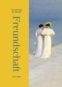 "Freundschaft" steht groß. Links gelber Streifen mit Text. Rechts Gemälde: Zwei Frauen in weißen Kleidern am Strand.