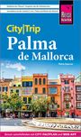 City|Trip Palma de Mallorca. Radfahren bis S’Arenal. Farbenfrohe Gebäude vor blauem Himmel. Marke "Reise Know-How".